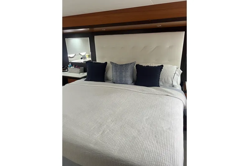 Slide: The Image of 2011 Hatteras yacht deck with seating, overlooking marina and waterfront homes. - 25