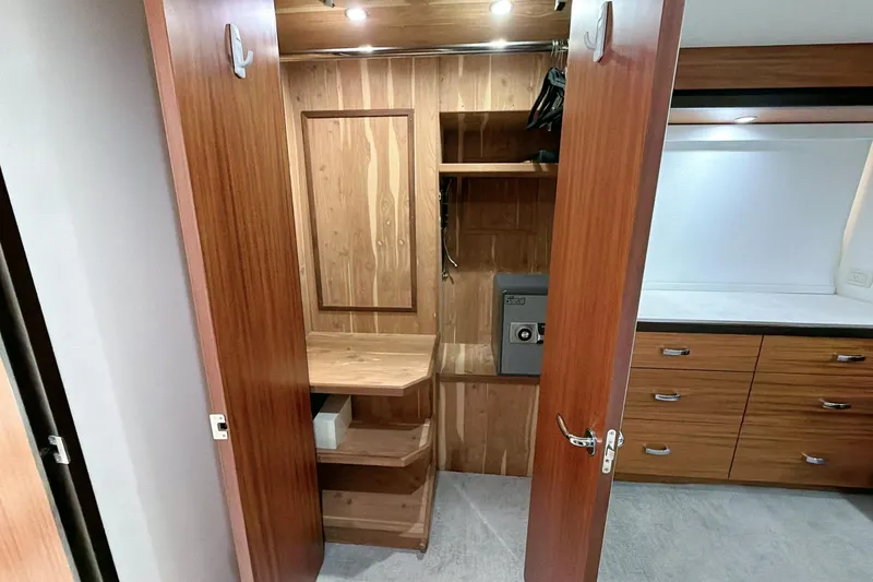 Slide: The Image of Luxurious interior of 2011 Hatteras 60 Motor Yacht with modern kitchen and dining area. - 31