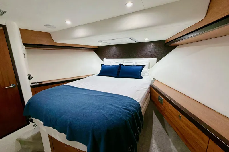 Slide: The Image of Luxurious bedroom interior of 2011 Hatteras 60 Motor Yacht with elegant wood finishes. - 34