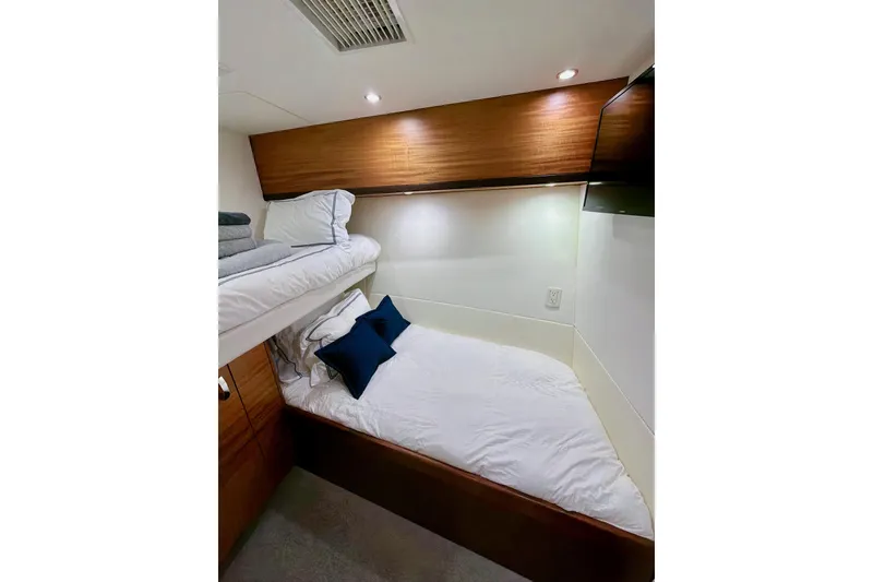 Slide: The Image of Luxurious bathroom in 2011 Hatteras 60 Motor Yacht with wooden cabinetry and marble accents. - 37