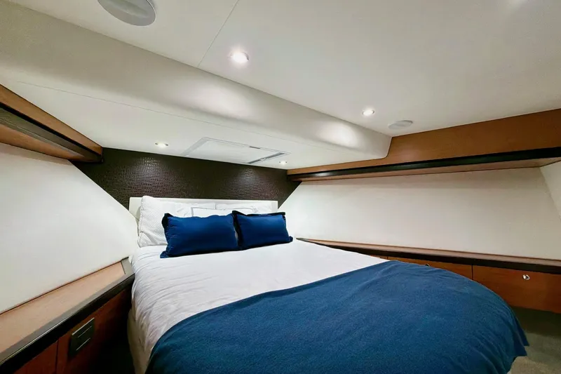 Slide: The Image of Hallway leading to a bedroom in a 2011 Hatteras 60 Motor Yacht. - 40