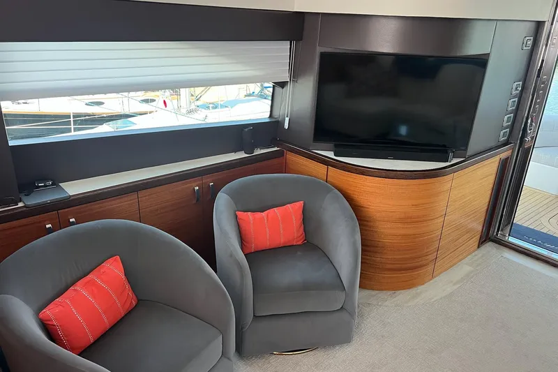 Slide: The Image of 2011 Hatteras 60 Motor Yacht cruising on a sunny day with clear blue skies. - 6