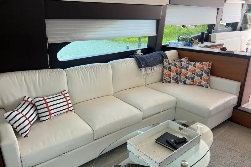 Slide: The Image of Luxurious interior of 2011 Hatteras 60 Motor Yacht with modern furnishings and spacious layout. - 9