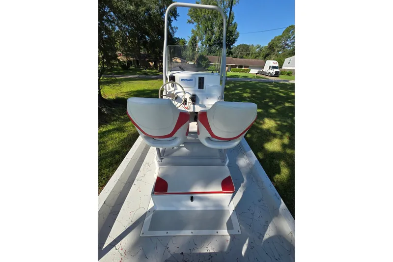 Slide: The Image of 2019 Gulf Coast Pro 22 boat interior with dual seats and steering console. - 12