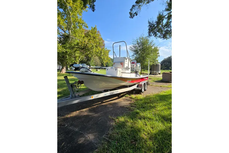 Slide: The Image of 2019 Gulf Coast Pro 22 boat on trailer, parked outdoors in a grassy area. - 3