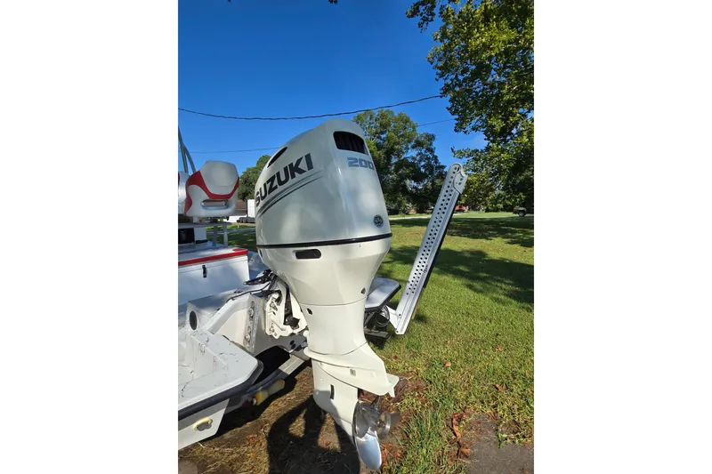 Slide: The Image of 2019 Gulf Coast Pro 22 boat with Suzuki outboard motor in grassy area. - 9