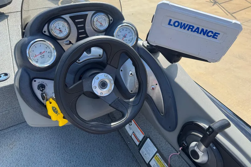 Slide: The Image of 2017 Bass Tracker PRO TEAM 190 dashboard with steering wheel and Lowrance fish finder. - 3