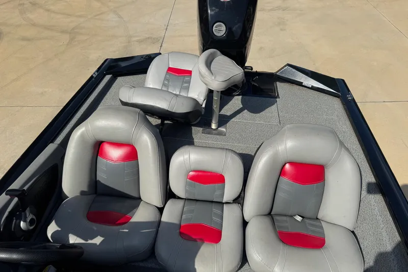 Slide: The Image of 2017 Bass Tracker PRO TEAM 190 boat interior with gray and red seating. - 4