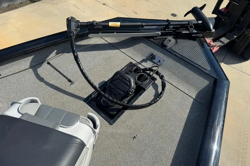 Slide: The Image of 2017 Bass Tracker PRO TEAM 190 boat deck with steering wheel and seat. - 6
