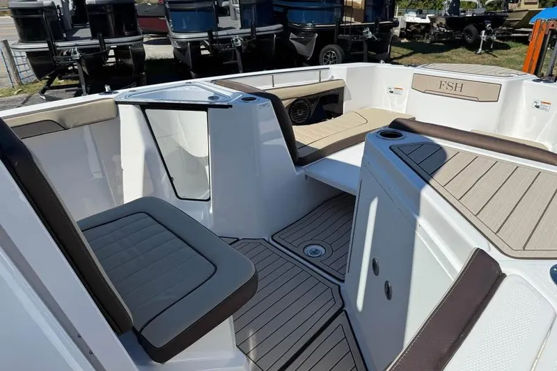 Slide: The Image of 2026 Yamaha Boats 255 FSH Sport H interior with seating and deck details. - 12