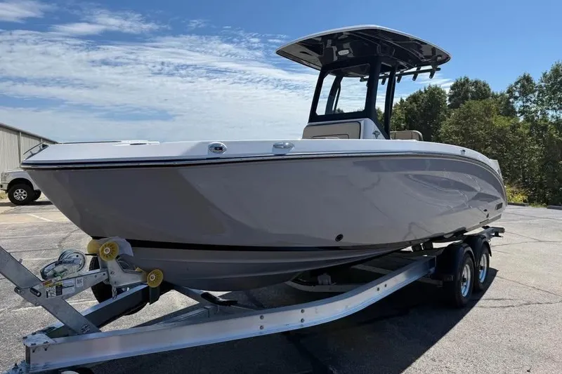 Slide: The Image of 2026 Yamaha Boats 255 FSH Sport H on trailer, parked outdoors under clear sky. - 3