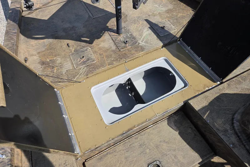 Slide: The Image of 2021 G3 Sportsman 1710 boat interior with open storage compartment. - 11