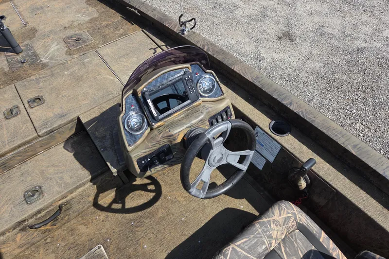 Slide: The Image of 2021 G3 Sportsman 1710 boat dashboard with steering wheel and control panel. - 12