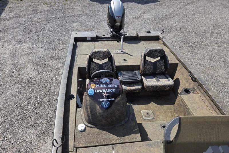 Slide: The Image of 2021 G3 Sportsman 1710 boat with camo seats and Minn Kota, Lowrance branding. - 14