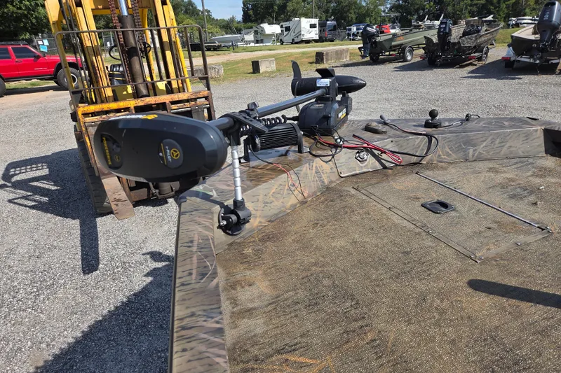 Slide: The Image of 2021 G3 Sportsman 1710 boat with trolling motor in outdoor setting. - 15