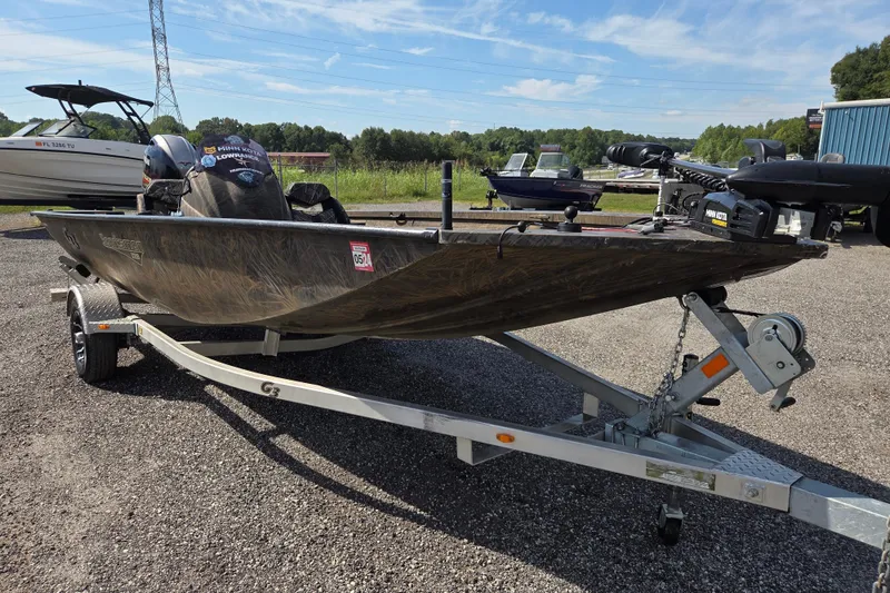 Slide: The Image of 2021 G3 Sportsman 1710 boat on trailer, parked outdoors under clear sky. - 3