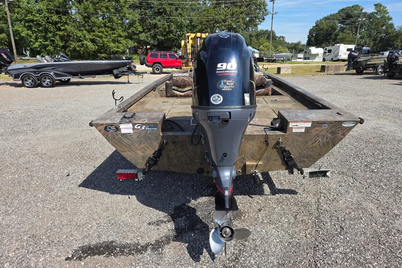 Slide: The Image of 2021 G3 Sportsman 1710 boat with 90 horsepower outboard motor, parked on gravel. - 5