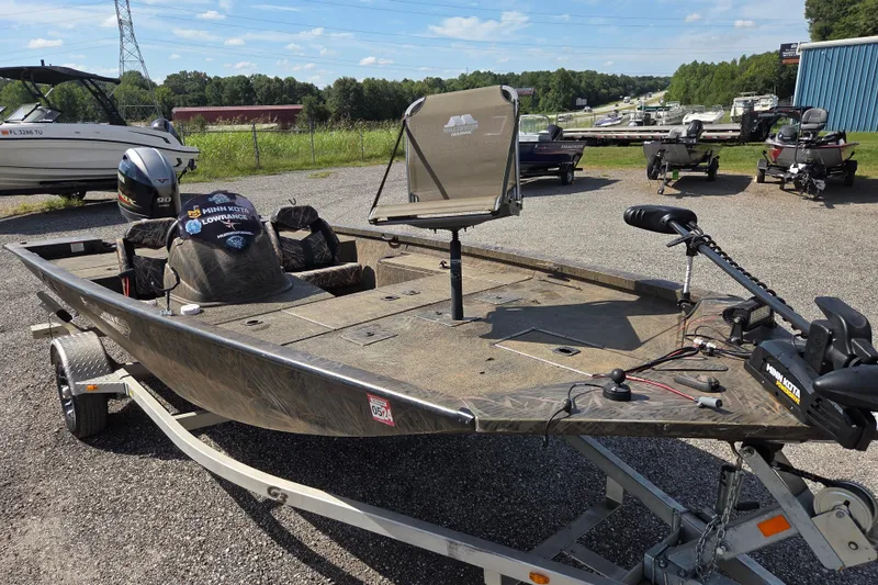Slide: The Image of 2021 G3 Sportsman 1710 fishing boat on trailer, equipped with Minn Kota motor. - 7