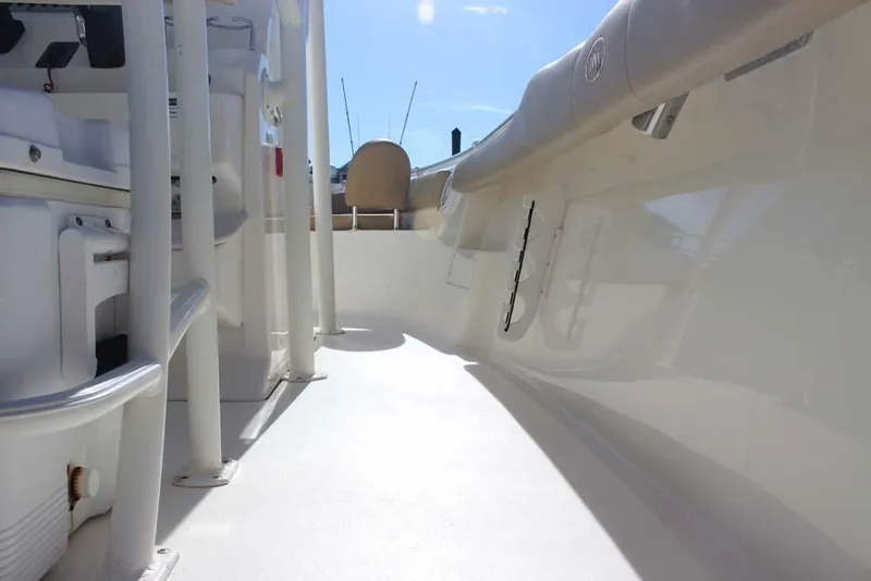 Slide: The Image of 2017 Key West 239 FS boat interior, showcasing sleek design and spacious deck. - 14