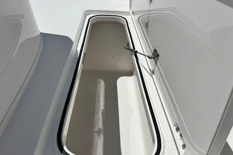 Slide: The Image of Open storage compartment on 2026 Caymas 34 CT boat, showcasing interior space. - 23