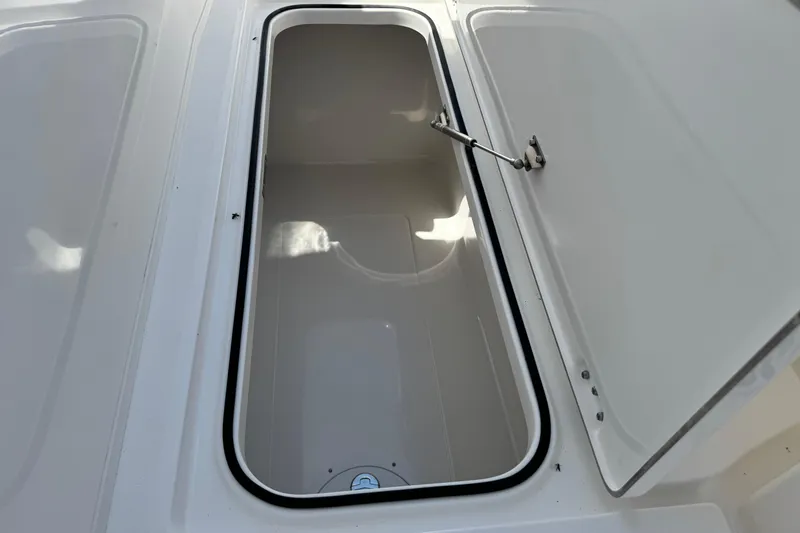 Slide: The Image of Open storage compartment on 2026 Caymas 34 CT boat, showcasing interior space. - 24
