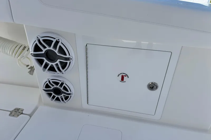 Slide: The Image of 2026 Caymas 34 CT boat interior with speakers and fire extinguisher compartment. - 25