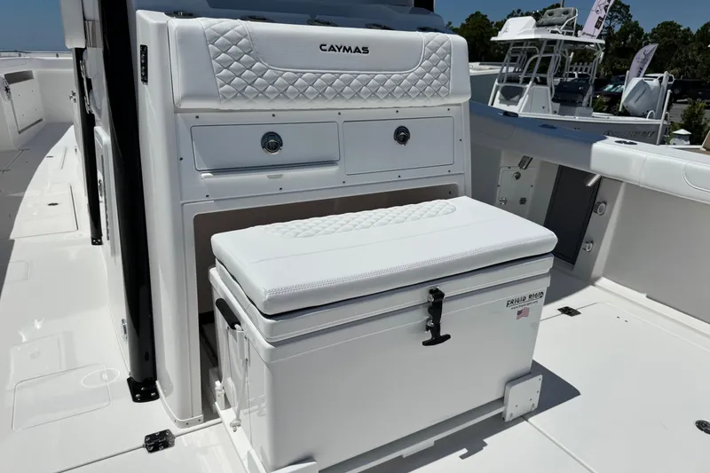 Slide: The Image of 2026 Caymas 34 CT boat interior with cushioned seating and storage compartments. - 29