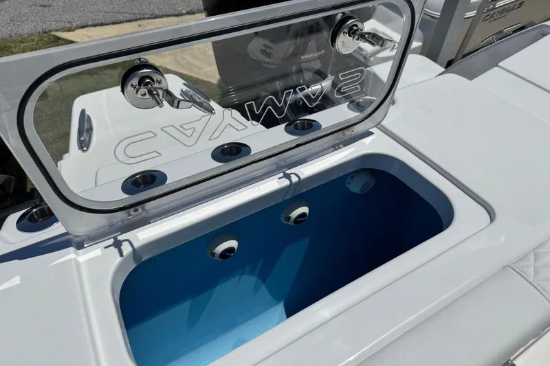 Slide: The Image of 2026 Caymas 34 CT boat livewell with open lid, showcasing interior design. - 34