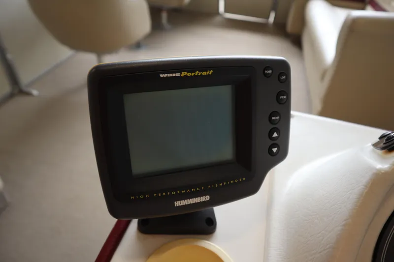 Slide: The Image of Humminbird fishfinder on 1997 Crest 25 Caribbean boat dashboard. - 14