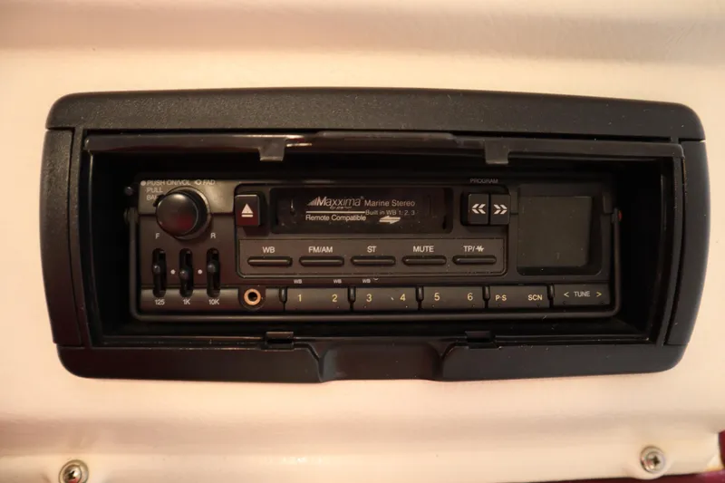 Slide: The Image of Marine stereo system on a 1997 Crest 25 Caribbean boat dashboard. - 18