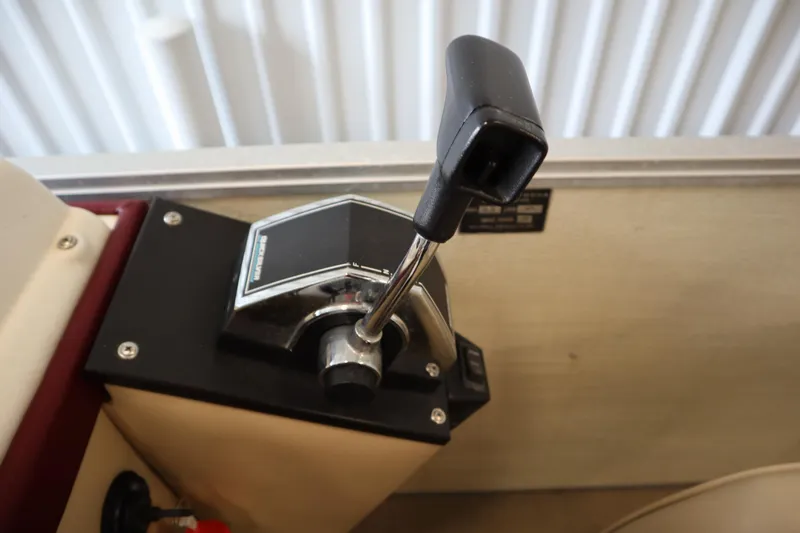 Slide: The Image of Throttle control lever on a 1997 Crest 25 Caribbean boat dashboard. - 19