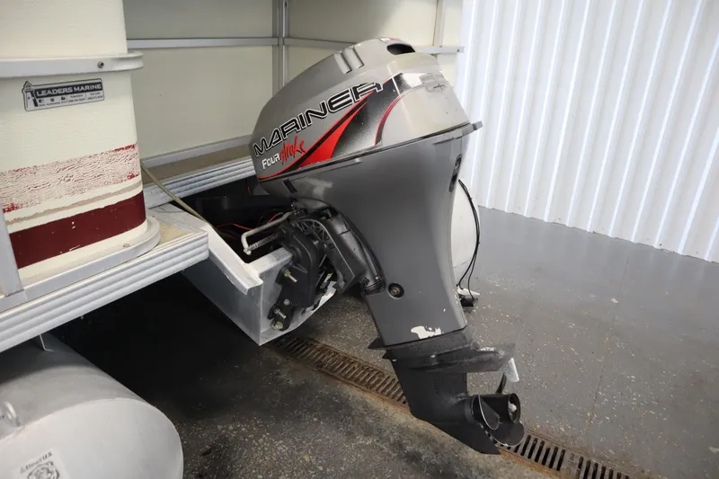 Slide: The Image of 1997 Crest 25 Caribbean boat with Mariner FourStroke outboard motor in storage. - 31