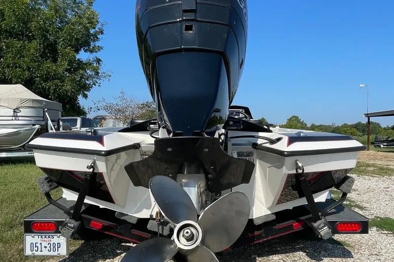 Slide: The Image of Rear view of a 2000 Bullet 21XD boat with outboard motor and trailer. - 8
