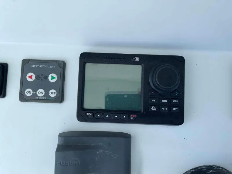 Slide: The Image of Control panel and display on a 2014 Yellowfin 42 boat dashboard. - 15