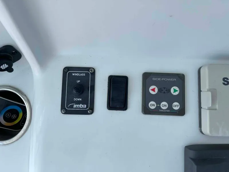 Slide: The Image of Control panel on a 2014 Yellowfin 42 boat featuring windlass and side power controls. - 18