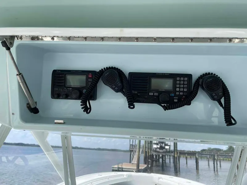 Slide: The Image of 2014 Yellowfin 42 boat with marine radios and microphones on the dashboard. - 19