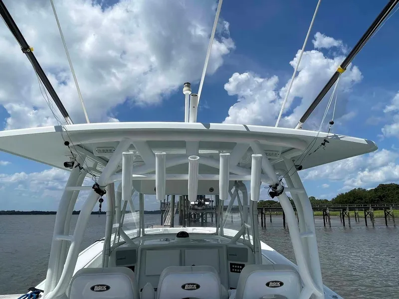 Slide: The Image of 2014 Yellowfin 42 boat docked under a blue sky with clouds. - 27