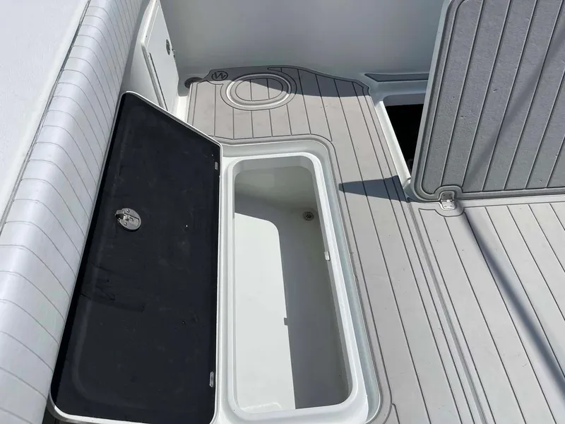 Slide: The Image of 2014 Yellowfin 42 boat storage compartment with open lid on deck. - 30