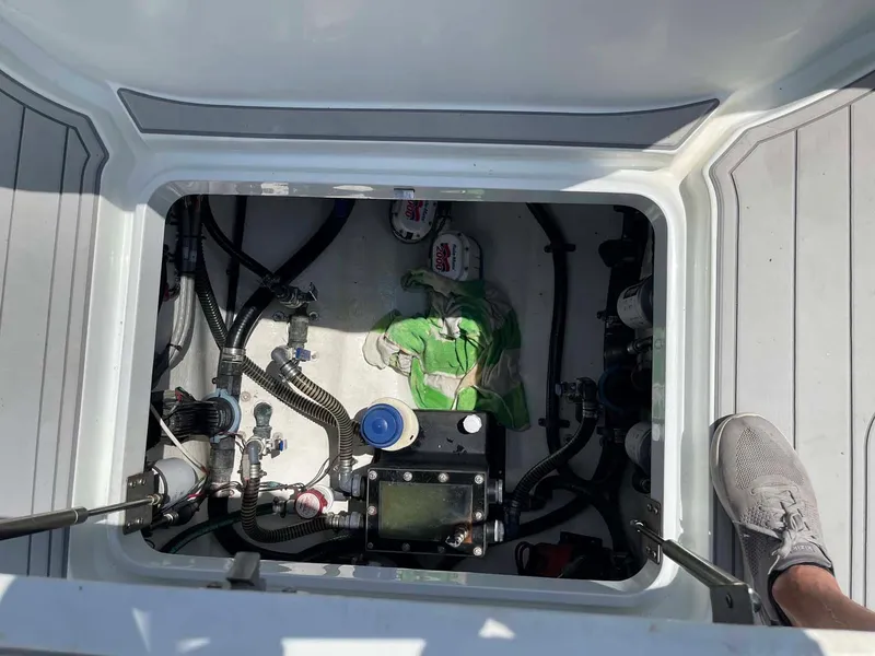 Slide: The Image of 2014 Yellowfin 42 boat compartment with mechanical components and wiring. - 33