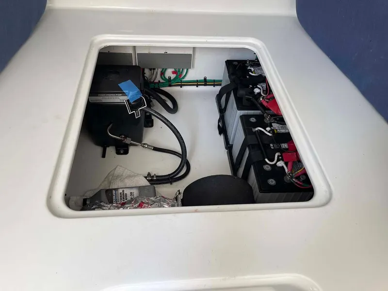 Slide: The Image of 2014 Yellowfin 42 boat battery compartment with wiring and equipment. - 35
