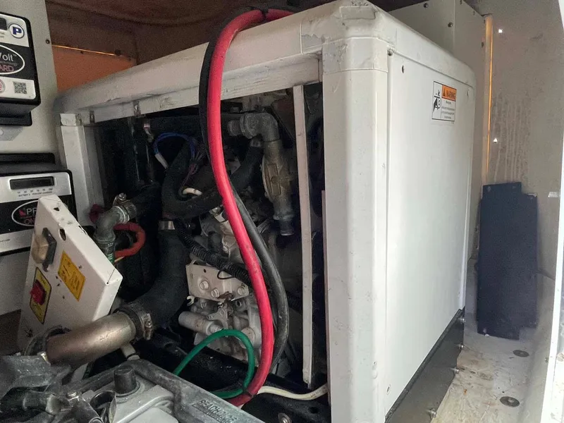 Slide: The Image of Engine compartment of a 2014 Yellowfin 42 boat, showing cables and components. - 37