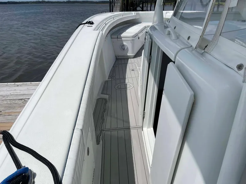 Slide: The Image of 2014 Yellowfin 42 boat deck with sleek white design and spacious layout. - 39