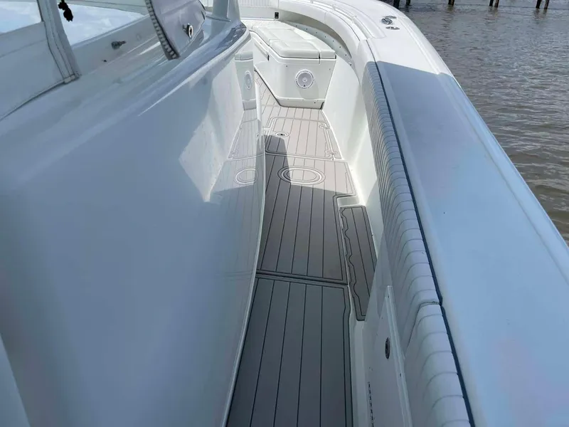 Slide: The Image of 2014 Yellowfin 42 boat deck with sleek design and spacious walkway. - 40