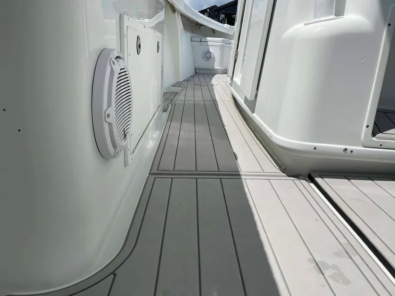 Slide: The Image of 2014 Yellowfin 42 boat deck with white speaker and sleek design. - 42
