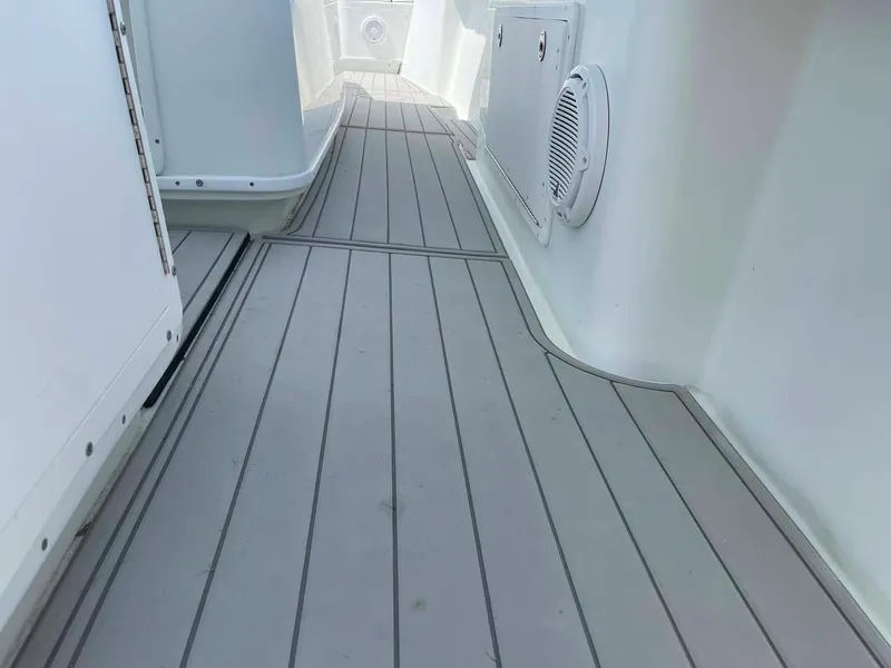 Slide: The Image of 2014 Yellowfin 42 boat deck with sleek, modern design and durable flooring. - 43
