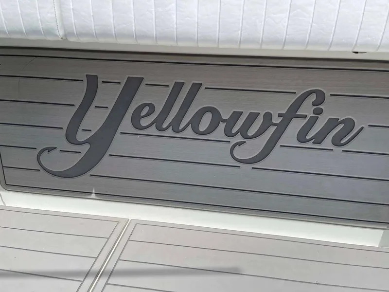 Slide: The Image of Yellowfin 42 boat logo on deck, 2014 model, sleek design. - 44