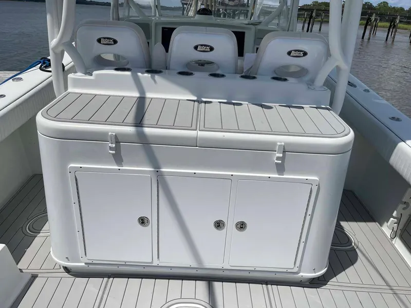 Slide: The Image of 2014 Yellowfin 42 boat interior with seating and storage compartments. - 45