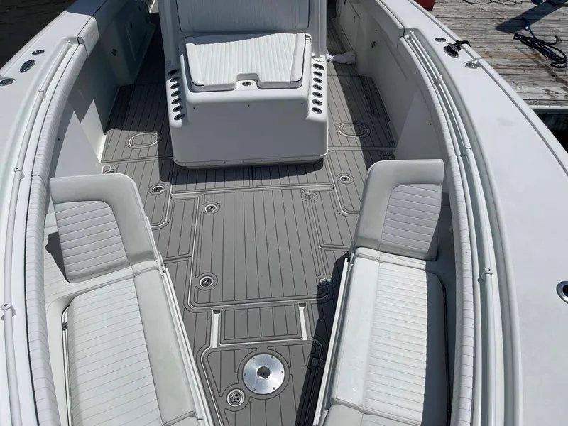 Slide: The Image of 2014 Yellowfin 42 boat interior with gray deck and white seating. - 6