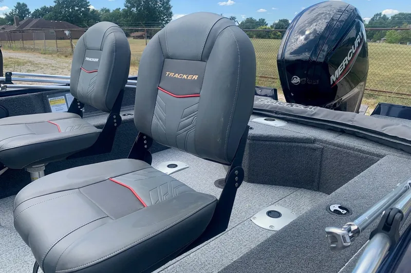 Slide: The Image of 2024 Tracker Pro Guide V-16 WT boat interior with Mercury engine, featuring comfortable seating. - 5