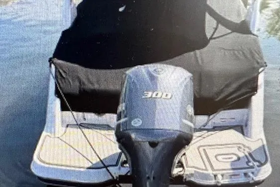Slide: The Image of 2018 Four Winns HD270 OB boat with 300 HP outboard engine, covered and docked. - 6